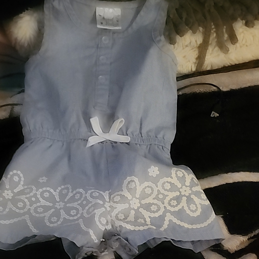 Blue Cotton Sleeveless Romper with White Floral Design